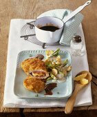Chicken Cordon Bleu with thyme jus and vegetables