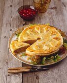 Game pie with cranberry sauce