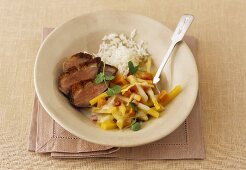 Fried duck breast with swede, papaya and coconut