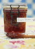 A jar of fig and grape jam