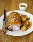 Roast pork with crackling and roast potatoes