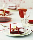 Festively laid Christmas table with red wine