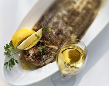 A whole fried plaice with white wine