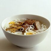 Oriental noodle soup with duck and a quails' egg