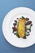 Turbot with a potato crust, spinach and red onion chutney