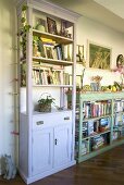 White bookshelf next to a half height shelf in country farm house style