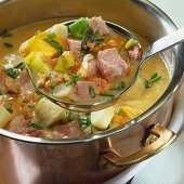 Meat and vegetables in thick pea soup
