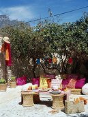 Floor cushions and table in garden