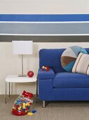 Blue couch, table and table lamp
