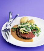 Sirloin steak with mustard, peas and potatoes