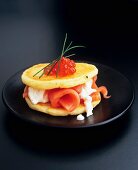 Potato pancakes with smoked salmon, horseradish and caviar