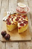 Cheesecake with plums, sliced