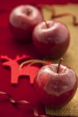 Three red apples as Christmas decoration