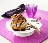 Profiterole with a mocca-cream filling and chocolate sauce