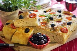Focaccia with tomatoes and black olives