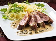 Duck breast with pepper sauce and tagliatelle
