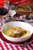 Panettone pudding with vanilla sauce for Christmas