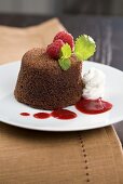 Chocolate souffle with mint and raspberry sauce