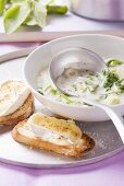 Spring onion soup with radish leaves and warm cheesey bread