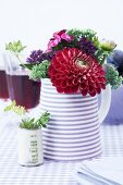Dahlias, stonecrops, euphorbia and Sweet William in a jug