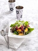 Mixed leaf salad with nectarines and sprouts