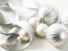 Silver Christmas baubles and ribbon
