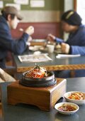 Dolsot bibimbap (Rice, vegetables & meat in stone pot, Korea)