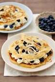 Pancakes with blueberries and cream