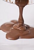 Pouring milk chocolate onto a plate