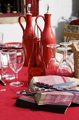 Table laid in red on a terrace