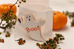 Paper bag candle lanterns and ghost biscuit for Halloween