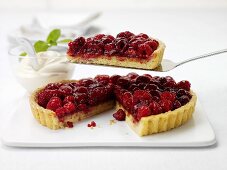 Raspberry tart, one piece on cake server