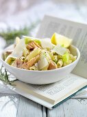 Penne with salmon and leeks on book