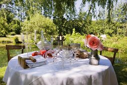 Laid table in romantic garden