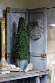 Box tree in metal bucket, door wreath and table decorations