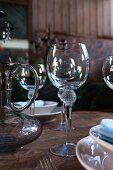 Carafe and wine glasses on table