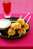 Pumpkin balls on skewers with yoghurt dip