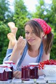 Young woman eating jam