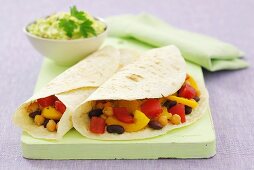 Beans, peppers and chick-peas in wheat tortillas