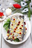 Trout with flaked almonds, herbs and cranberries