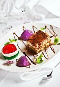 Tiramisu and jelly on dessert plate (Italy)