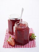 Two jars of strawberry jam