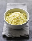 Couscous in bowl on cloth