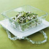 Rice with green vegetables in a glass dish