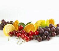 Still life with fruit (cherries, grapes, citrus fruit)
