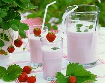 Strawberry shake in jug and glasses