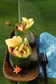 Exotic fruit salad in a banana leaf