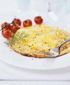 Cheese pancake with cocktail tomatoes