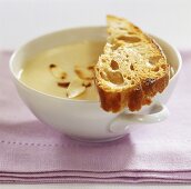 Cold almond cream soup with toasted bread