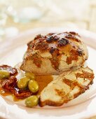 Roast pork stuffed with dried tomatoes and olives